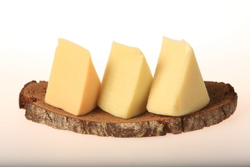 Triangle pieces of cheese next to each other