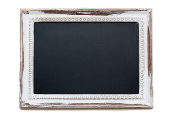 Fototapeta premium Chalkboard with Distressed white painted picture frame. Weathered white timber