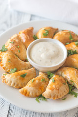 Mini chicken pies with creamy garlic sauce