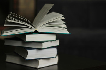 A stack of books on the table.