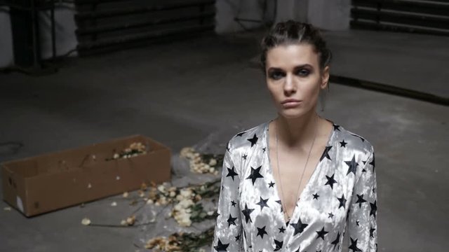 Girl is going to trample roses