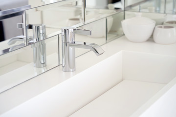 Bathroom interior sink with modern design. Interior of bathroom with washbasin and faucet