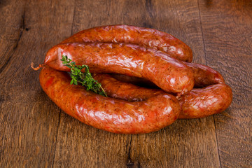 Pork sausages over wooden