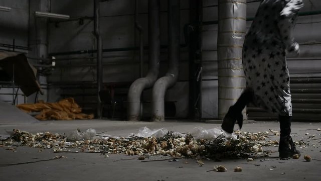 Woman is trampling white roses