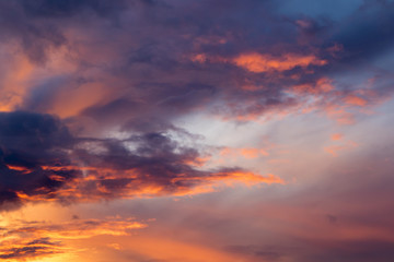 Naklejka na ściany i meble Storm clouds at sunset, dramatic sky