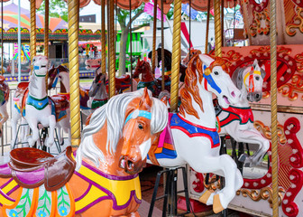 Brightly colored carousel horses © Kristen