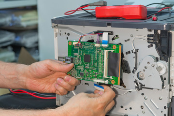 Disassembly of the laser printer for repair.