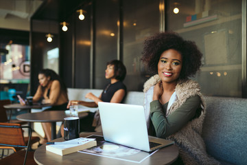 Portrait of smiling businesswoman working in the office