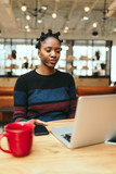 Young businesswoman working on laptop in the office
