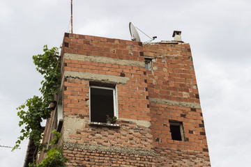 facade of old incomplete brick building