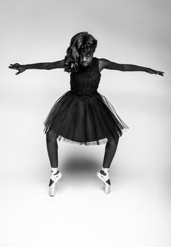 Portrait of girl doing ballerina pose