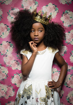 Girl standing against floral background