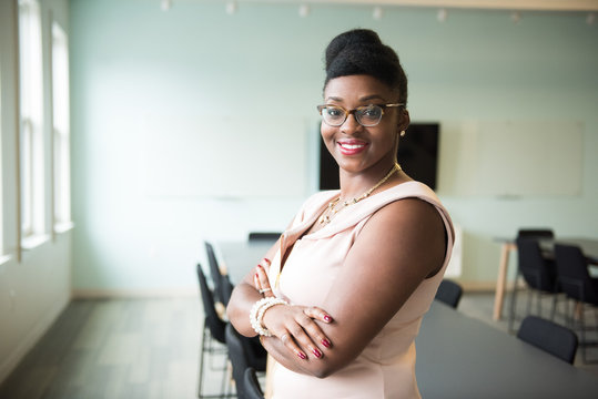 Portrait of smiling businesswoman standing in the office
