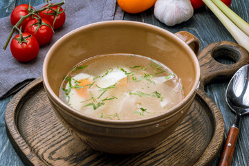 Chicken soup bouillon in a plate