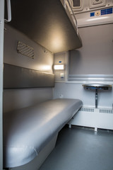 classic interior of sleeping car of train. interior of compartment car. Passenger train car....