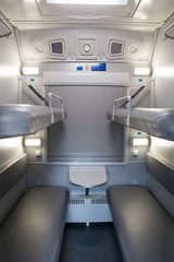 classic interior of sleeping car of train. interior of compartment car. Passenger train car. Sleeping car of passenger train