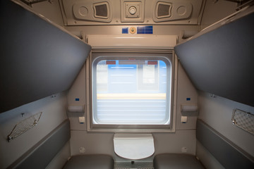 classic interior of sleeping car of train. interior of compartment car. Passenger train car. Sleeping car of passenger train