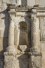 Ancient columns on exterior of Alamo in San Antonio TX