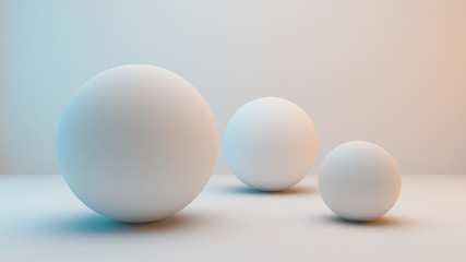 Milky white spheres isolated on white background with slightly blue and orange lighting . 3D Rendering