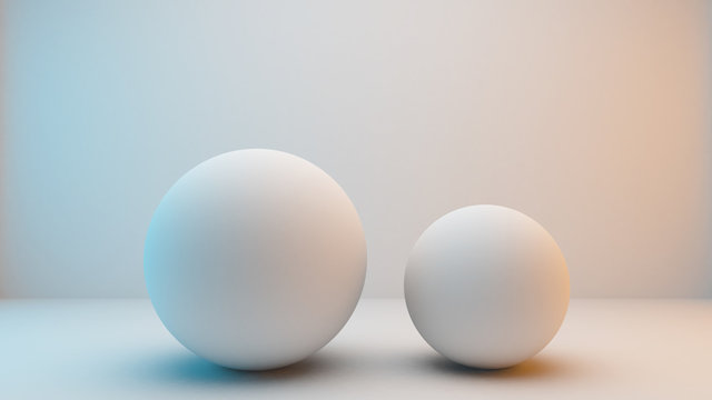 Milky white spheres isolated on white background with slightly blue and orange lighting . 3D Rendering © jamesteohart