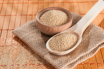 Raw Organic Amaranth grain on wooden table