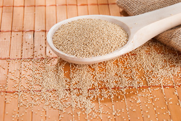 Raw Organic Amaranth grain on wooden table
