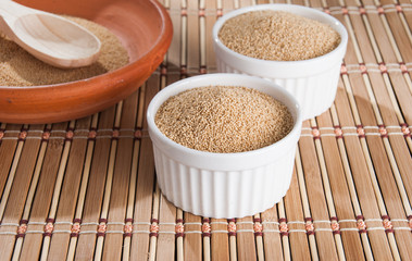 Raw Organic Amaranth grain on wooden table