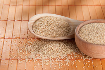 Raw Organic Amaranth grain on wooden table