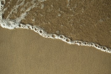  sea foam on a sand background