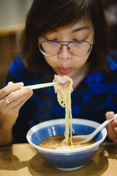 Asian Women Eating Ramen