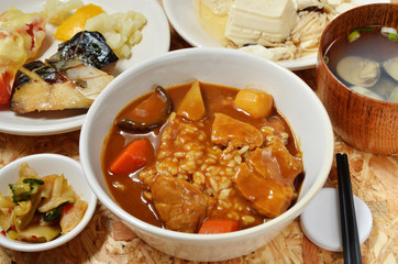 Pork curry with rice in a bowl