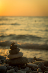 stack of zen stones on pebble beach