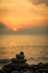 stack of zen stones on pebble beach