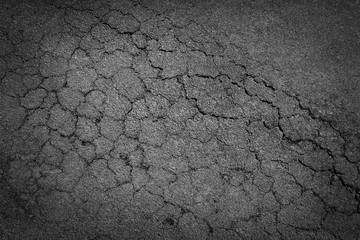 Fototapeta premium crack background texture of rough asphalt