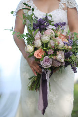 Wedding Photography: Bride in a Cap Sleeve Lace Wedding Dress Holding a Beautiful Large White, Blush, Pink, Peach, Purple Bridal Bouquet with Elegant Purple and Lilac Silk Ribbons