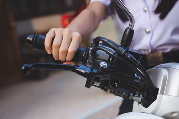 Thai female students Driving a motorcycle