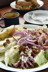 Fresh and healthy salad on a wooden table
