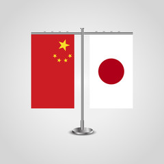 Table stand with flags of China and Japan.Two flag. Flag pole. Symbolizing the cooperation between the two countries. Table flags