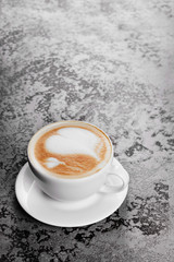 Cappuccino coffee on gray table background