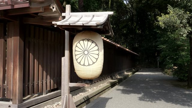 a paper lantern with royal emblem at meiji jingu shrine in tokyo, japan