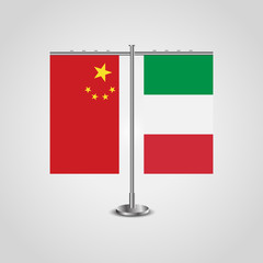 Table stand with flags of China and Italy.Two flag. Flag pole. Symbolizing the cooperation between the two countries. Table flags
