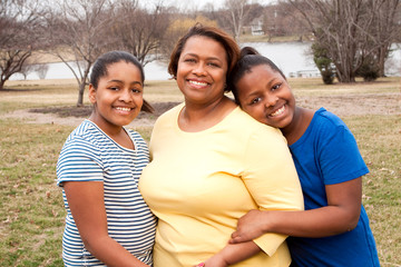Obraz premium Happy African American Mother And Her Daughters.
