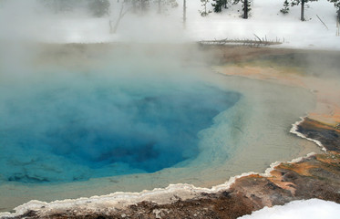 Naklejka na ściany i meble Hot spring thermal pool during winter in the upper geyser basin Yellowstone National Park in Wyoming United States