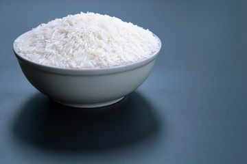 Fototapeta na wymiar bowl of jasmine white rice on black backgrounds