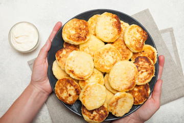 Traditional russian breakfast cheesecake, pancakes.