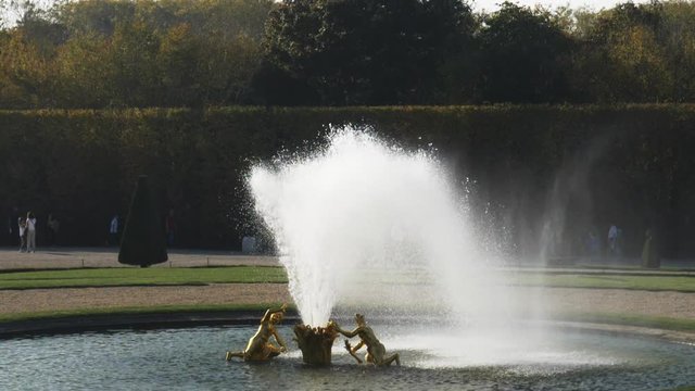 slow motion shot of a fountain in the gardens of versailles palace in paris, france- originally recorded at 180fps