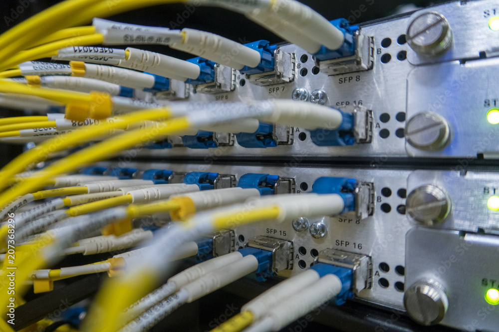 Aufkleber severs computer in a rack at the large data center. rack mounted servers. the image has a little noi