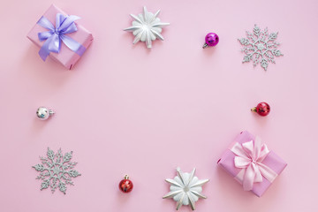 Fototapeta na wymiar Christmas composition Flat lay boxes with gifts satin ribbon bow Christmas toys snowflakes.