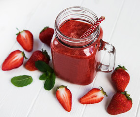 Jar with strawberry smoothie