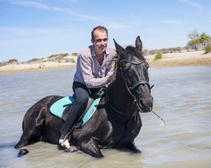 Fototapeta na wymiar rider and horse on the beach